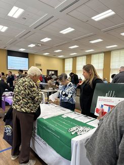 This image from the Spring Into Wellness event held on May 15 features a public safety table sharing fire prevention and emergency preparedness information