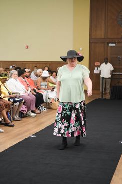 The Rock the Runway Fashion Show at the Raymond Jordan Senior Center showcased a lively community gathering featuring a full runway, an engaged audience, and a diverse lineup of participants presenting a wide range of unique outfits, from formal attire and coordinated sets to cultural garments and creative designs. Attendees filled the room, capturing moments on their devices and applauding each model who walked the runway, including individuals dressed in detailed patterns, bright colors, textured fabrics, accessories, and themed ensembles. The event included stage moments, presentations, and celebratory gestures, adding to its energetic atmosphere. Supported by the Springfield Department of Elder Affairs, the fashion show emphasized creativity, self‑expression, local engagement, and community pride, with in‑person registration and event details promoted through the official Rock the Runway flyer for July 11, 2025.